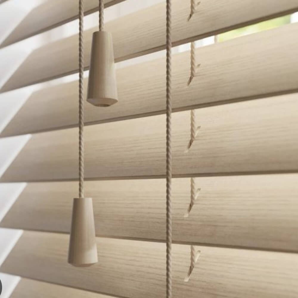 Wooden Venetian blinds in a bay window